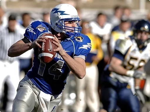 A football player running with the ball