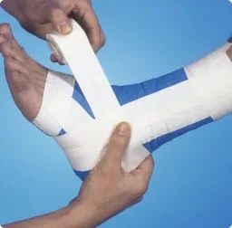Strapping tape applied around the foot and ankle